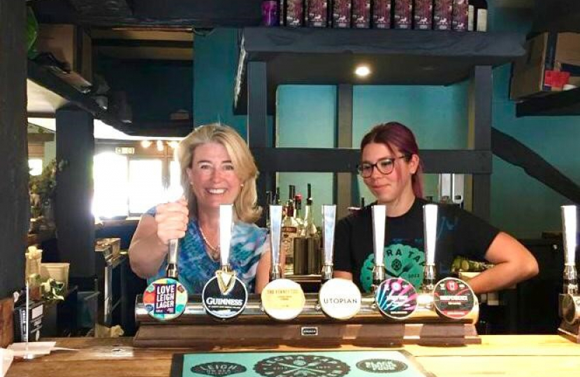 Anna Firth MP pulling a pint