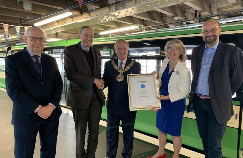 Anna and Mayor Stephen Habermel received the award from the National Pier Society representatives 