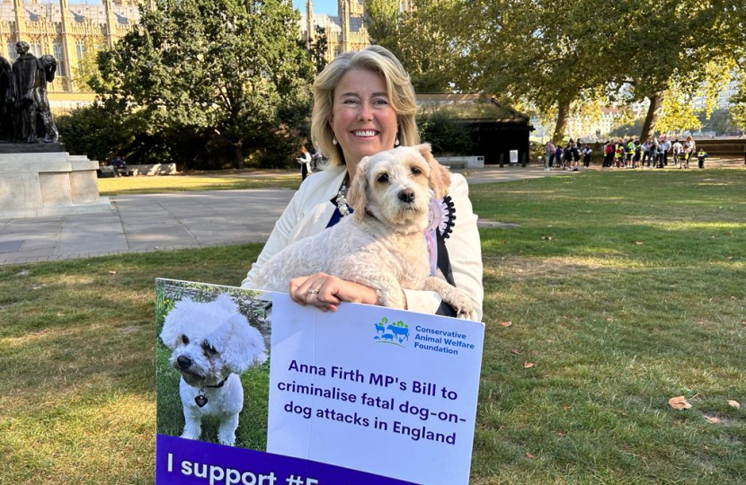 Anna Firth with billboard and dog Lottie