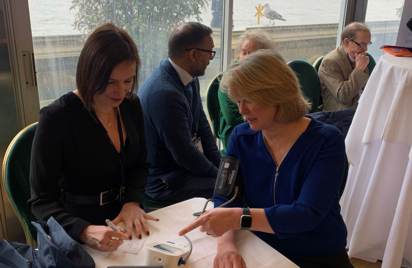 Anna Firth MP getting her blood pressure tested at the event