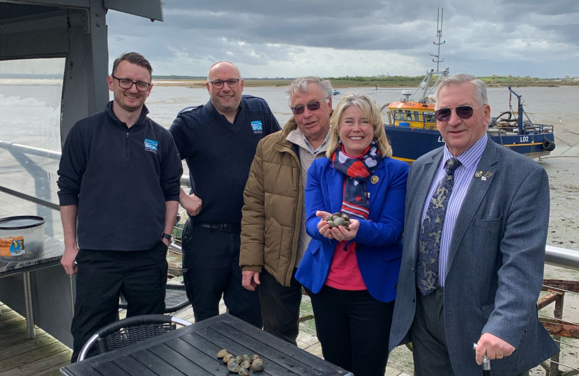 With the officials and fishermen