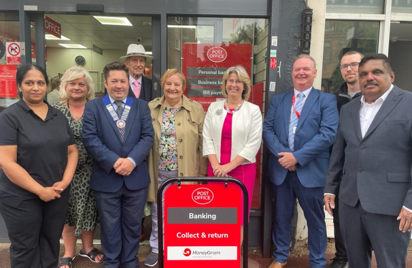 Anna Firth MP (centre) with representatives from the Post Office, SAVS, and local councillors Nigel Folkard and Bernard Arscott in front of the Post Office at 101 Broadway West, Leigh