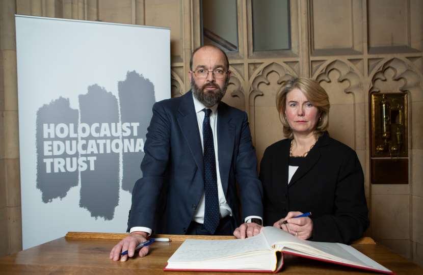 Anna signing the Book with Sir James Duddridge