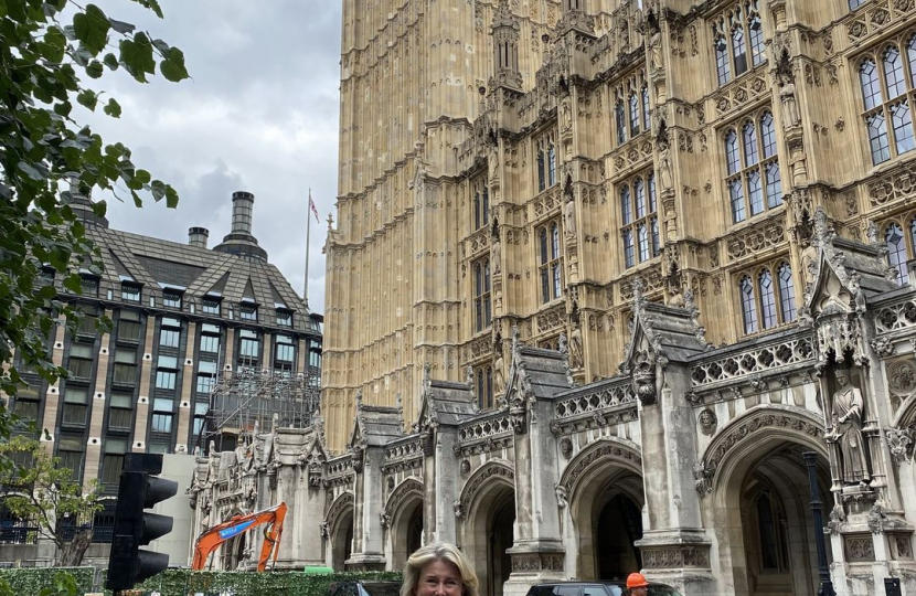 Anna Firth MP with statute outside Big Ben 