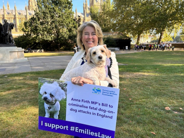 Anna Firth with billboard and dog Lottie