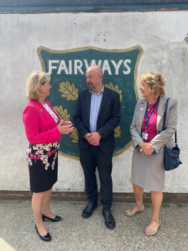 Anna Firth with Fairways Headmaster, Southend City Councillor Helen Boyd and Prefab classrooms.