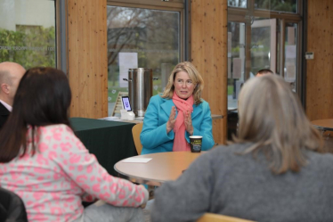 Anna talking to group of constituents 