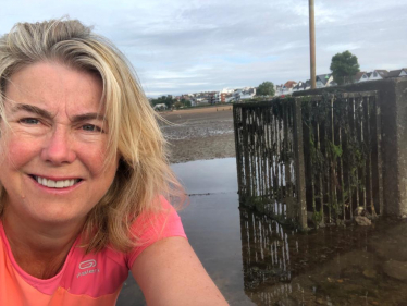 Anna Firth next to a storm overflow in Southend West