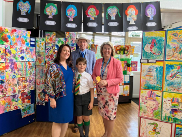 (L-R) Jadie Patricia Oberholzer with her son Cornelius, Councillor Nigel Folkard and Anna Firth MP at St Pierre School