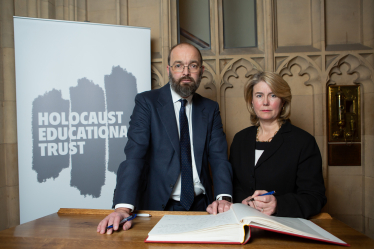 Anna signing the Book with Sir James Duddridge