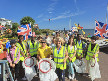 Anna Firth doing beach clean up with work experience students